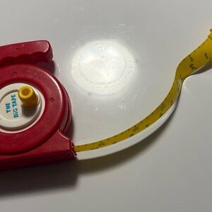 Red Measuring Tape with Yellow Tape